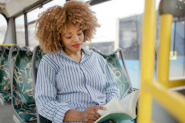 istock Black Woman Reading in Public Transport 1495102029