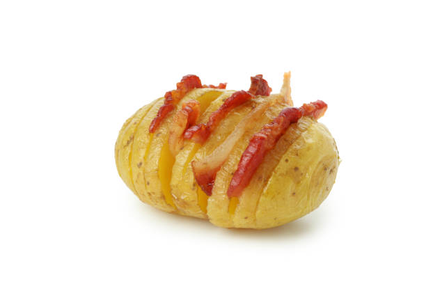 Baked potato with bacon isolated on white background.