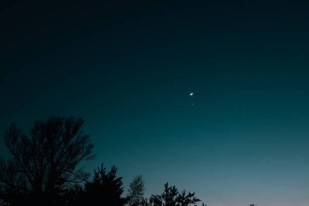 istock Real sky with stars and crescent. Crescent moon with beautiful sunset background . Light from sky . 1495104559