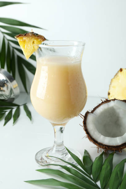 istock Pina colada cocktail and ingredients on white table 1495108319