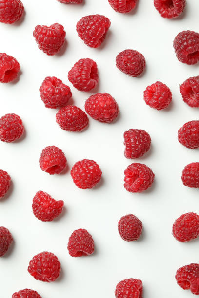 istock Flat lay composition with  red juicy raspberries on a white background 1495113832