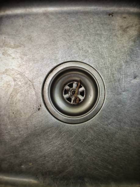 istock Defocused abstract background of a kitchen sink hole. 1495120386