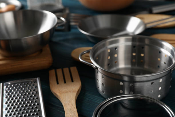 istock Different kitchen utensil on blue wooden background 1495121022