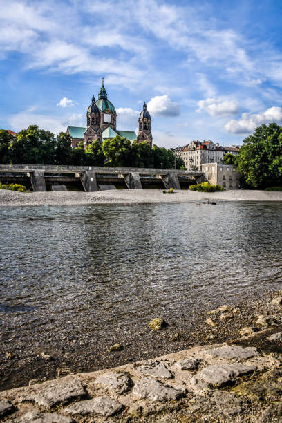 istock Isar River Beach Beneath St. Lukas Cathedral In Munich, Germany 1495125068