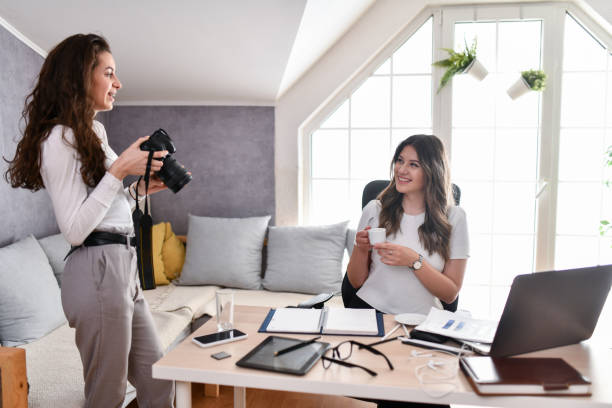istock Female Photographer Documenting Her Friend And Freelancing Work Lifestyle 1495130429