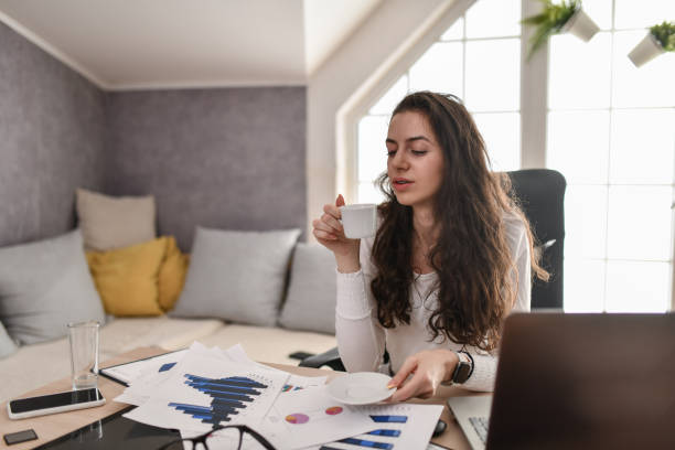 istock Morning Coffee And Graphic Charts Analysis By Female Office Worker 1495130646