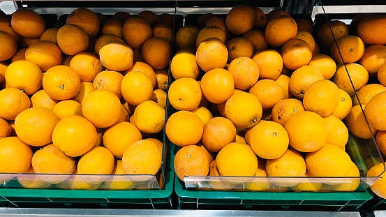 Orange fruit in basket at fruit market or supermarket,fresh fruit market