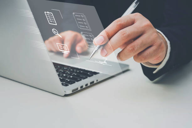 istock E-document management Paperless workplace, e-signing, Business people sign electronic documents on digital documents, electronic signature concept, paperless office, future business contract signing. 1495132444