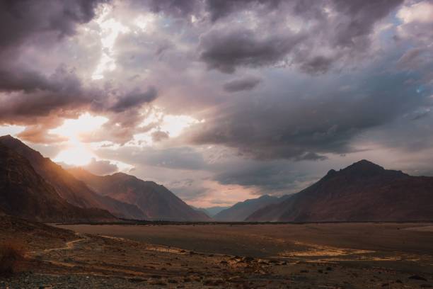 istock Scenic view of barren mountains under a cloudy sky 1495135380