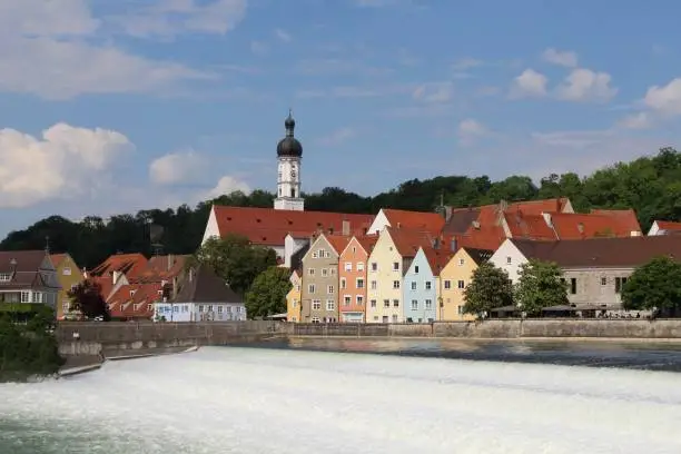 Landsberg am Lech, a historic town in Upper Bavaria. In the foreground, the river Lech, which has been dammed. The area is also called the "Lechwehr" or "Karolinenwehr".