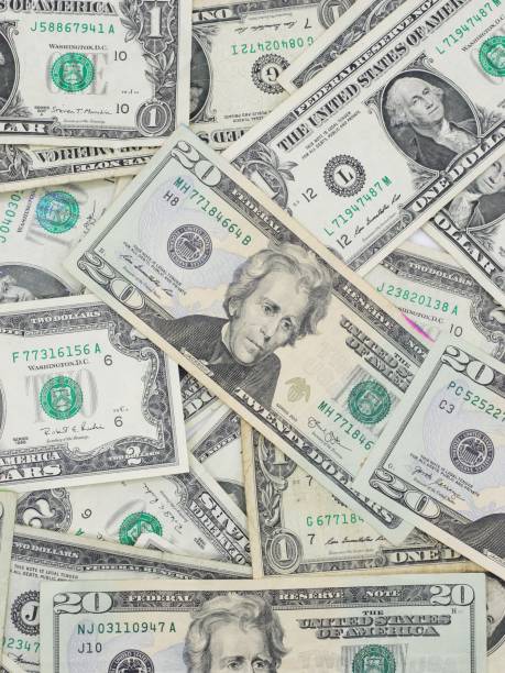 istock Several $20, $1 and $2 Bills Close Up on Surface 1495139250