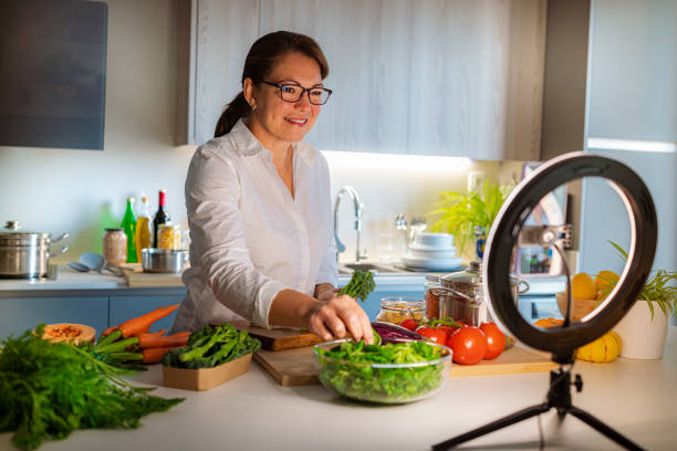 istock Mature woman streaming online virtual cooking lesson 1495139457