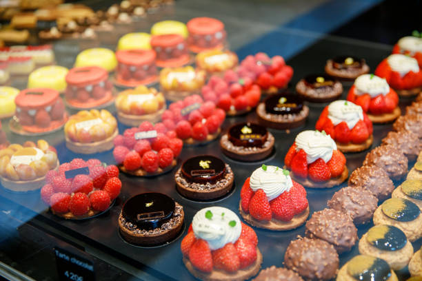 istock French pastries on display in store window of cafe or bakery. 1495139525