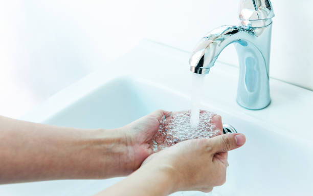 istock Hands being washed under stream of pure water from tap 1495139720