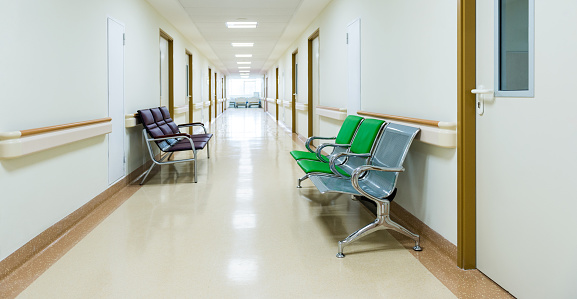 Empty chairs in the hospital hallway