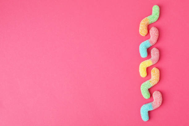 istock Gummy candies on pink background, space for text 1495143593