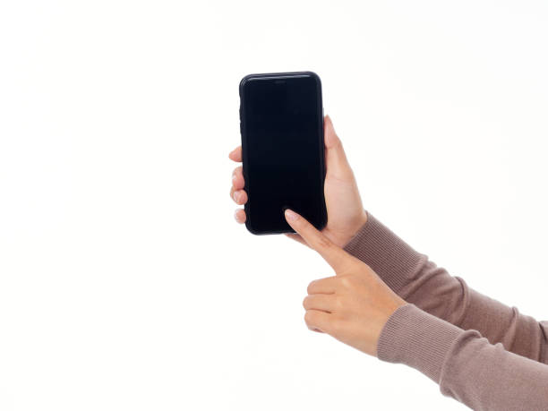 istock Woman holding smartphone with blank screen on white background 1495145947