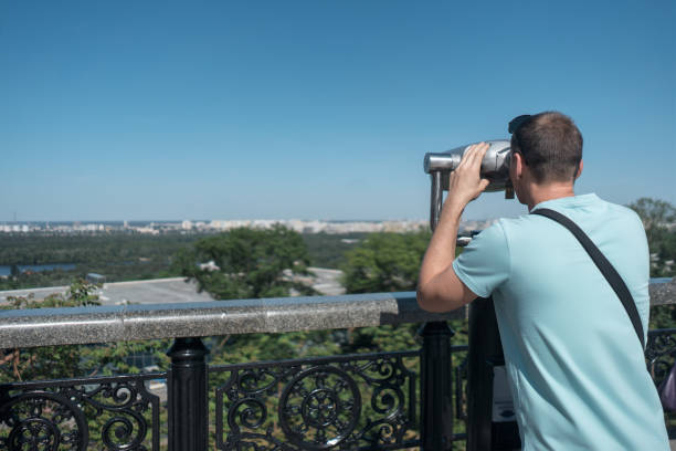 istock young tourist looking at sightseeing observation binocular 1495146608