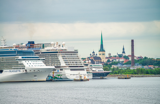 cruise ship in sea port. Cruise liner in sea harbor. World round trip tour. Cruising for pleasure. Travelling by water. Summer vacation and wanderlust