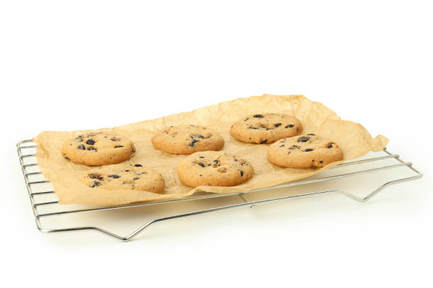 istock Baking rack with pumpkin cookies isolated on white background 1495148619