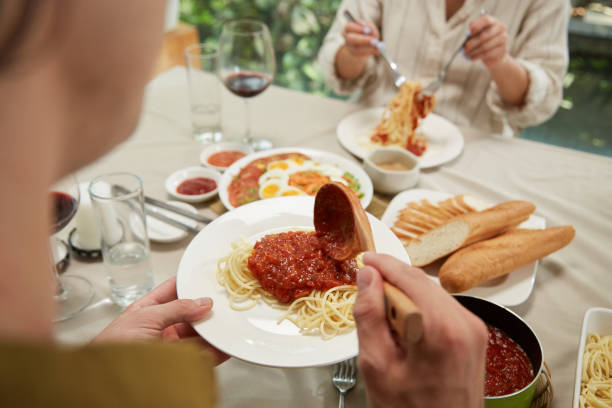 istock Man Eating Spaghetti Bolognese 1495156484