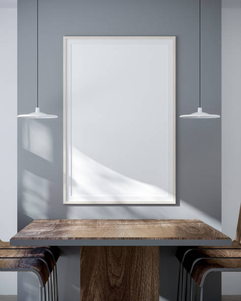 Set wooden tables, chairs, cream white walls. Blank wooden vertical photo frame mockup gray wall backdrop simple ceiling lamp natural light shines The shadow fell on the wooden floor. 3D render coloque mesas de madera, sillas, paredes de color blanco crema. marco de fotos vertical de madera en blanco maqueta gris telón de fondo de pared simple lámpara de techo luz natural brilla la sombra cayó sobre el piso de madera. renderizado 3d