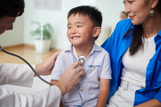 Smiling Boy Looking at Doctor