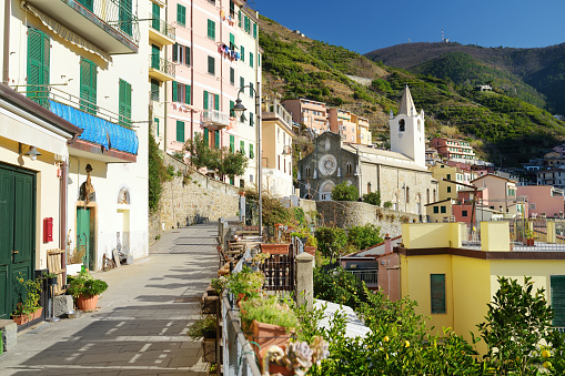 Pastel houses of Riomaggiore, the largest of the five centuries-old villages of Cinque Terre, located on rugged northwest coast of Italian Riviera, Liguria, Italy.