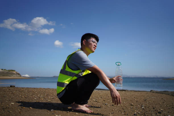 istock Environmentalists drink water on the beach 1495161328