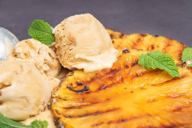 istock Grilled pineapple with vanilla ice cream and mint leaves 1495161785