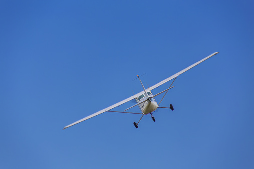 Cessna light aircraft ever built with overhead wing and single propeller in the blue sky