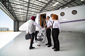 Cabin Crew Welcoming Young Tech Entrepreneur To Private Jet