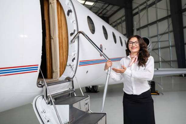 istock Air Hostess Welcoming Viewer To Private Jet 1495164548