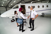 Young Tech Entrepreneur Shakes Hands With Pilot on Steps of Private Jet