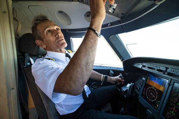 istock Pilot Pressing Control Buttons In Cockpit Of Private Jet 1495164567