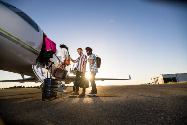 istock Group Of Friends Walking Into a Private Jet 1495164730