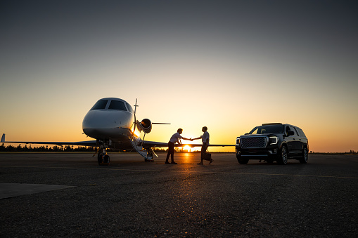 Business aircraft parked on an airport