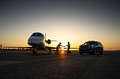 Pilot Shaking Hands With Wealthy Passenger