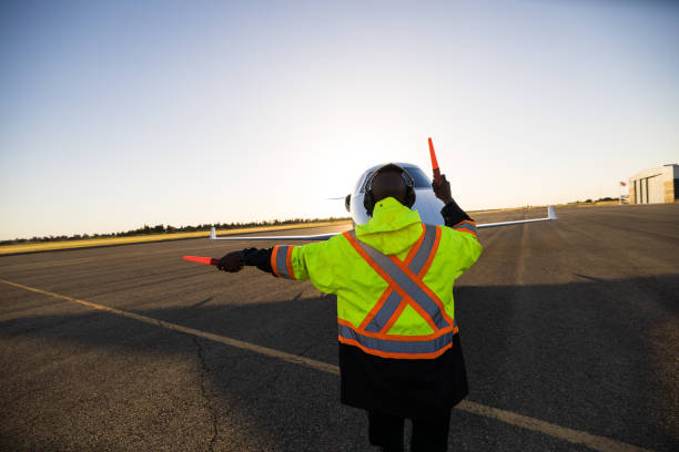 istock African American Marshal Signaling Private Jet At Sunset 1495164754