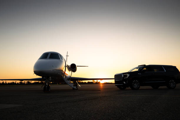 istock Black Luxury SUV Parked Next To Private Jet 1495164768