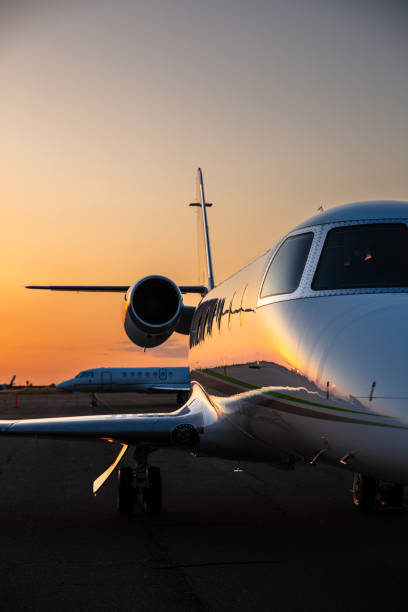istock Half Cropped Shot Of Private Jet On Runway 1495164840