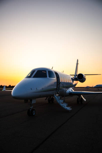 istock Vertical Image Of Private Plane On Runway During Sunset 1495164853