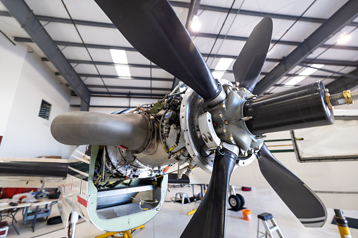 Still image of a jet propellor inside the hangar of a small general aviation airport in California.