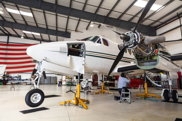 istock Mechanic Working On Turboprop Plane's Wing 1495165049