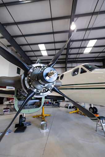 Still image of a jet propellor inside the hangar of a small general aviation airport in California.