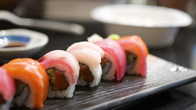 Sushi roll on the dish at Sushi Bar at Japanese restaurant