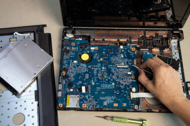 istock top view, mechanic repairing laptop computer 1495165235