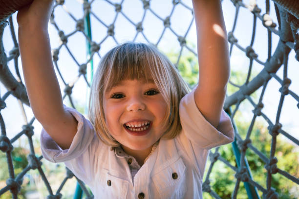 istock Little child climbing on a playground 1495166620