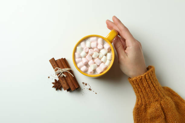 istock Female hand hold cup with cocoa on white background 1495167345