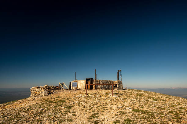 istock Remains Of Burned Fire Tower Below Deep Blue Sky On Mt Holmes 1495167619